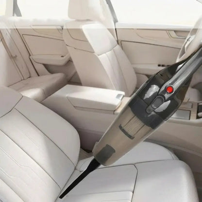 Car interior with a handheld vacuum cleaner cleaning the seats