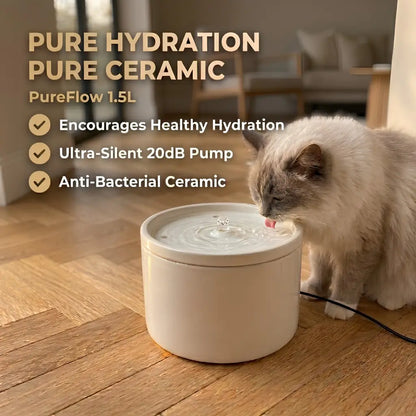 Cat drinking from a ceramic water fountain with text highlighting features on a wooden floor.