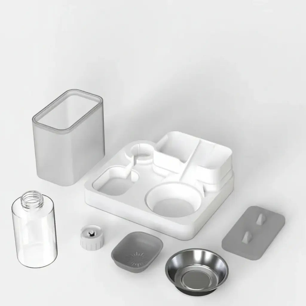 Collection of pet water and food dispenser components on a light gray background