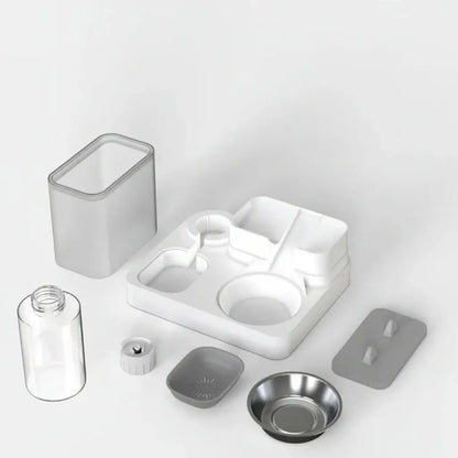 Collection of pet water and food dispenser components on a light gray background