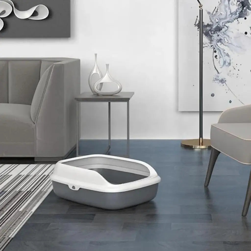 Gray and white pet litter box in a modern living room with furniture and decor