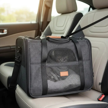 Gray pet carrier on a car seat with a blurred background