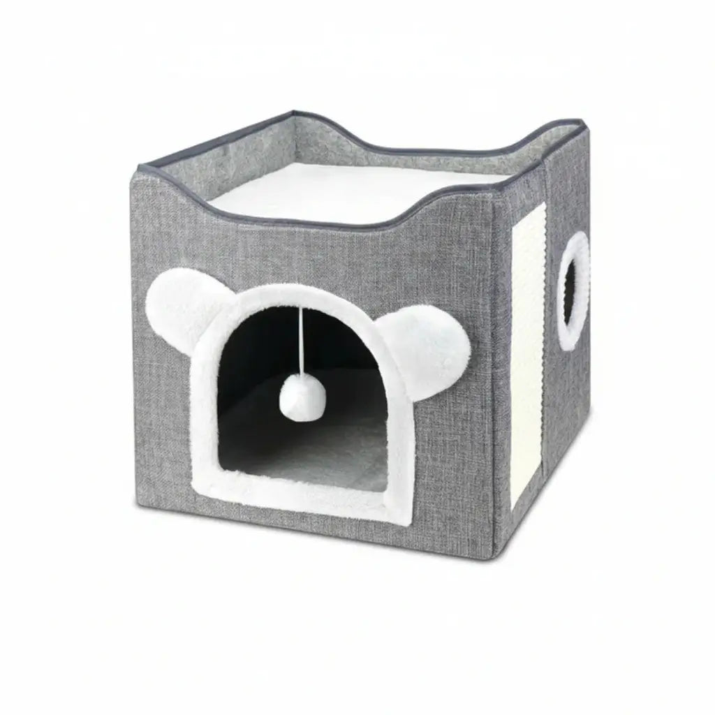 Gray pet house with white interior and a hanging ball on a white background
