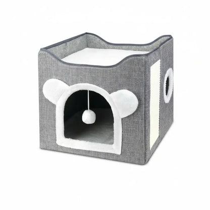 Gray pet house with white interior and a hanging ball on a white background