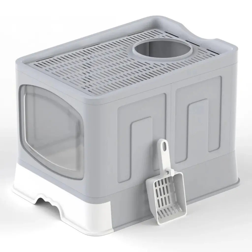 Gray pet litter box with a scoop on a white background