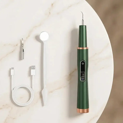 Green_dental_tool_with_attachments_on_a_marble_surface