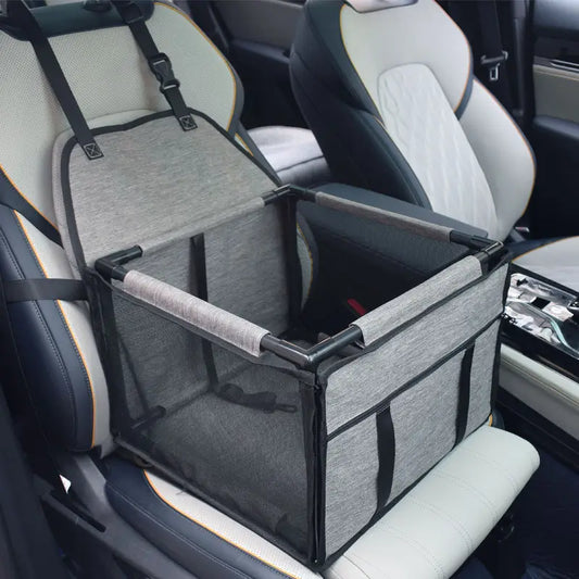 Light grey SeatGuard foldable dog car booster seat installed on a car front seat