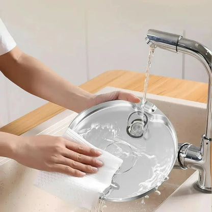 Person cleaning a stainless steel water fountain sink with running water from a faucet