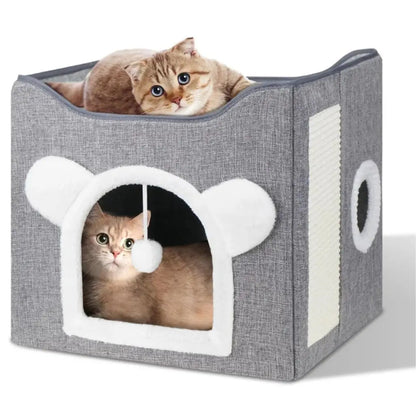 Two cats inside a gray pet house with white accents on a white background