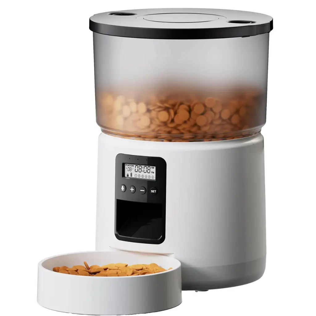 White pet food dispenser with a digital display and a bowl of pet food on a white background