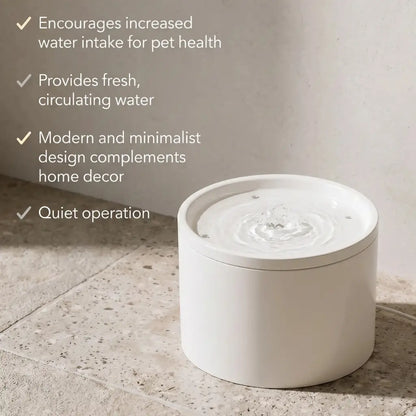 White pet water fountain on a tiled floor with text highlighting its benefits.