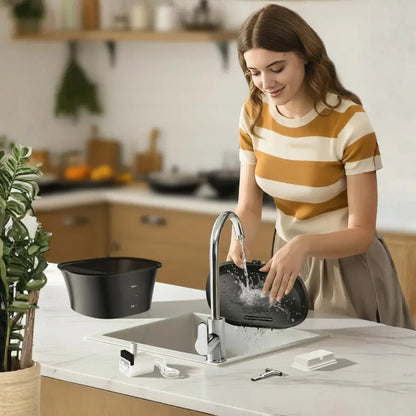 Woman washing cat water fountain in a modern kitchen with a faucet and sink