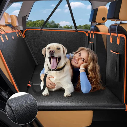 Woman with a dog sitting on a car seat cover in a vehicle